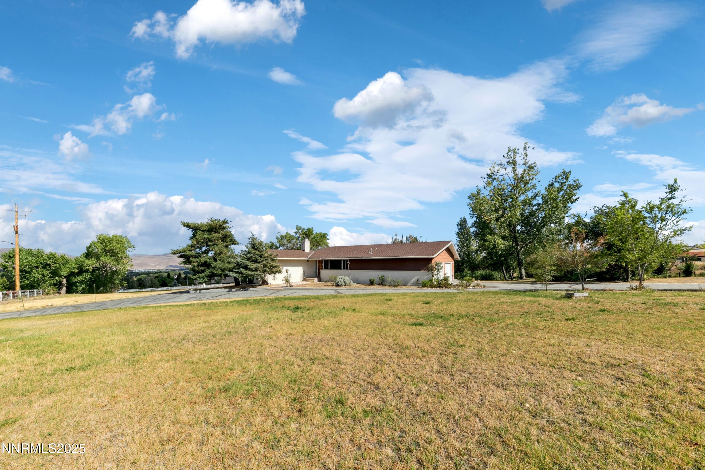 3550 Lone Tree Lane Reno, NV 89511 - Photo 7 of 40 a view of a swimming pool and an outdoor space