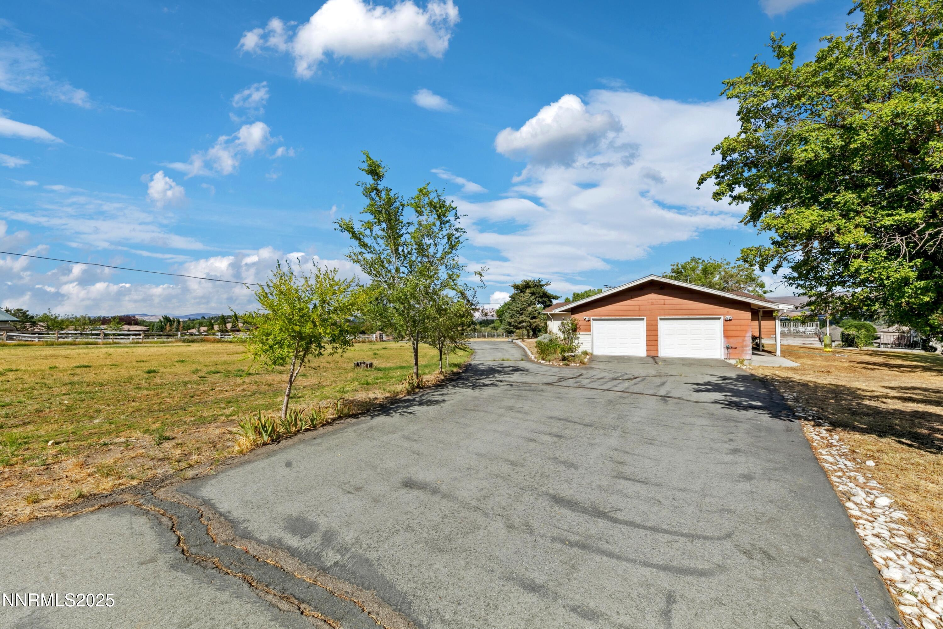 3550 Lone Tree Lane Reno, NV 89511 - Photo 8 of 40 a view of a street with a yard