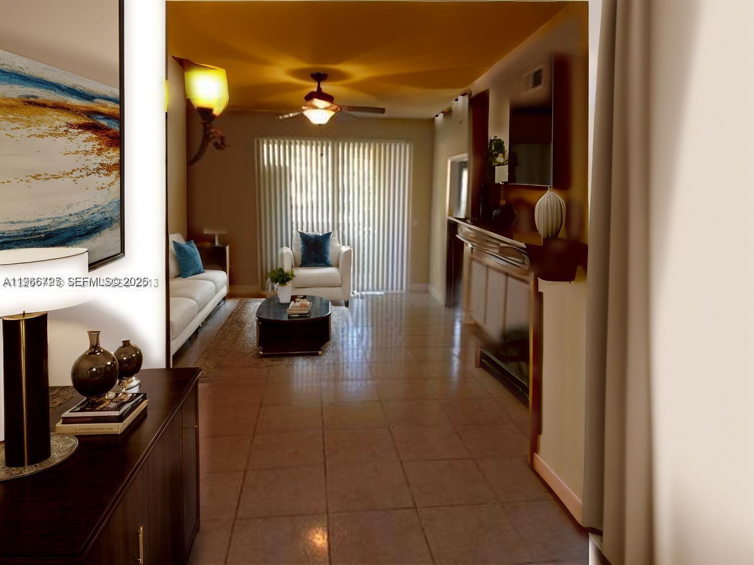 18330 Northwest 68th Avenue, Unit A Hialeah, FL 33015 - Photo 13 of 14 a living room with furniture and a flat screen tv