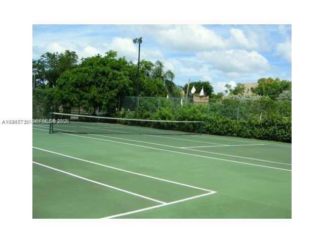 18330 Northwest 68th Avenue, Unit A Hialeah, FL 33015 - Photo 4 of 14 a view of a tennis court