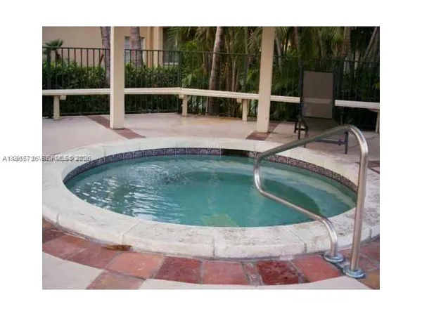 a view of a swimming pool with a lounge chair