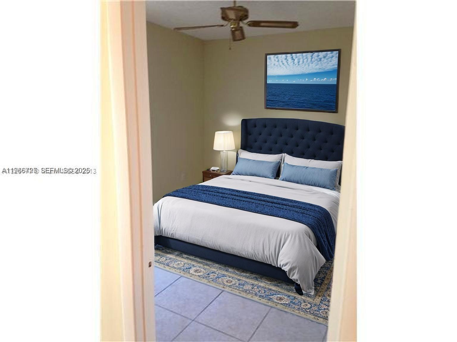 18330 Northwest 68th Avenue, Unit A Hialeah, FL 33015 - Photo 9 of 14 a bedroom with a bed and a cabinets