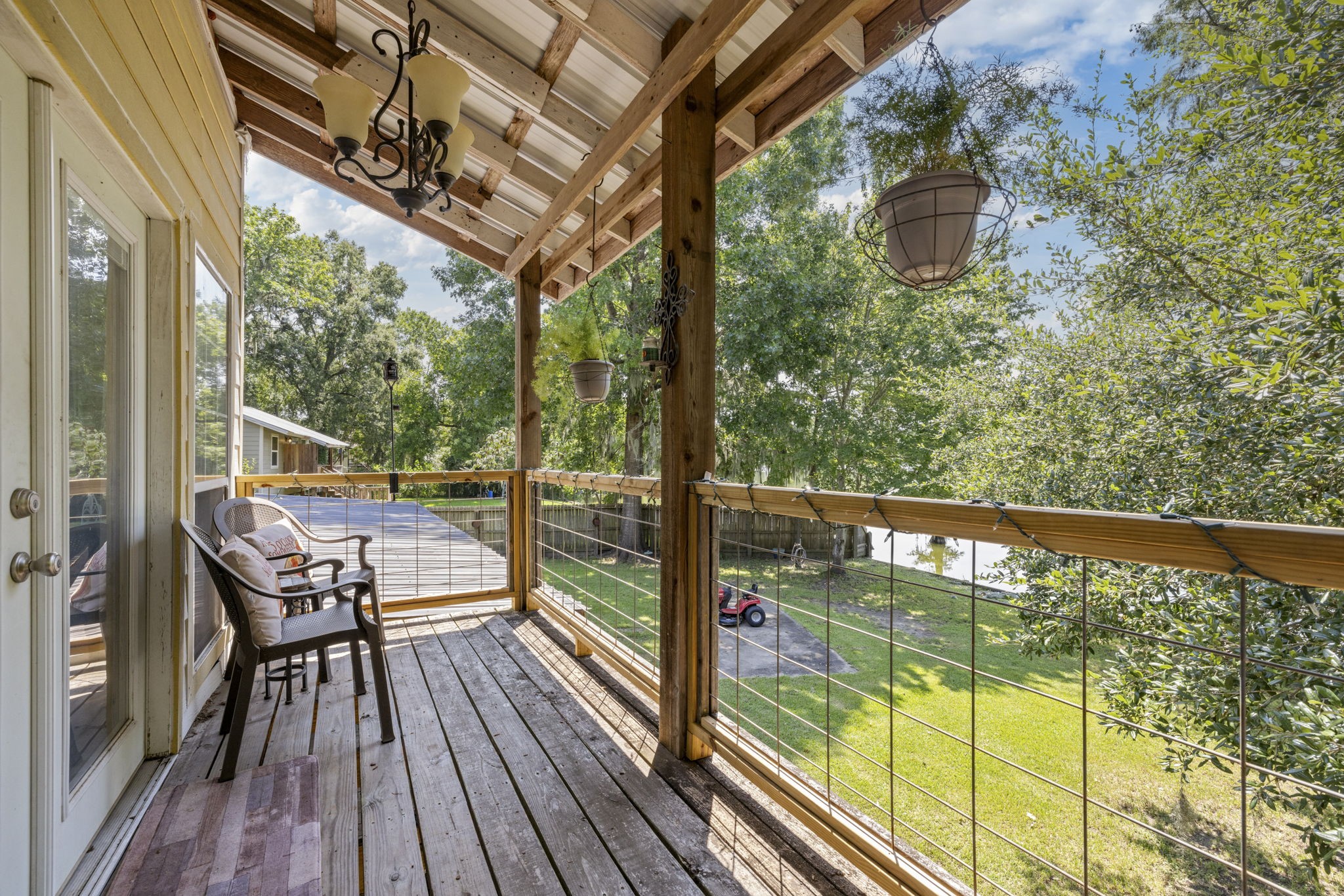 150 County Road 2122 Cleveland, TX 77327 - Photo 15 of 21 a view of balcony with couch and wooden floor