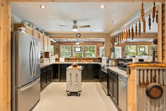 a kitchen with a sink stove and refrigerator