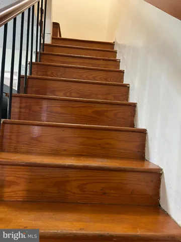 a bedroom with a bed and dresser