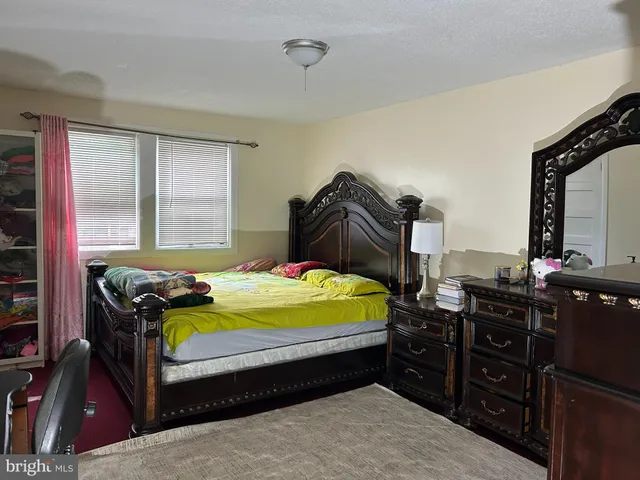 a room with a bed and couch