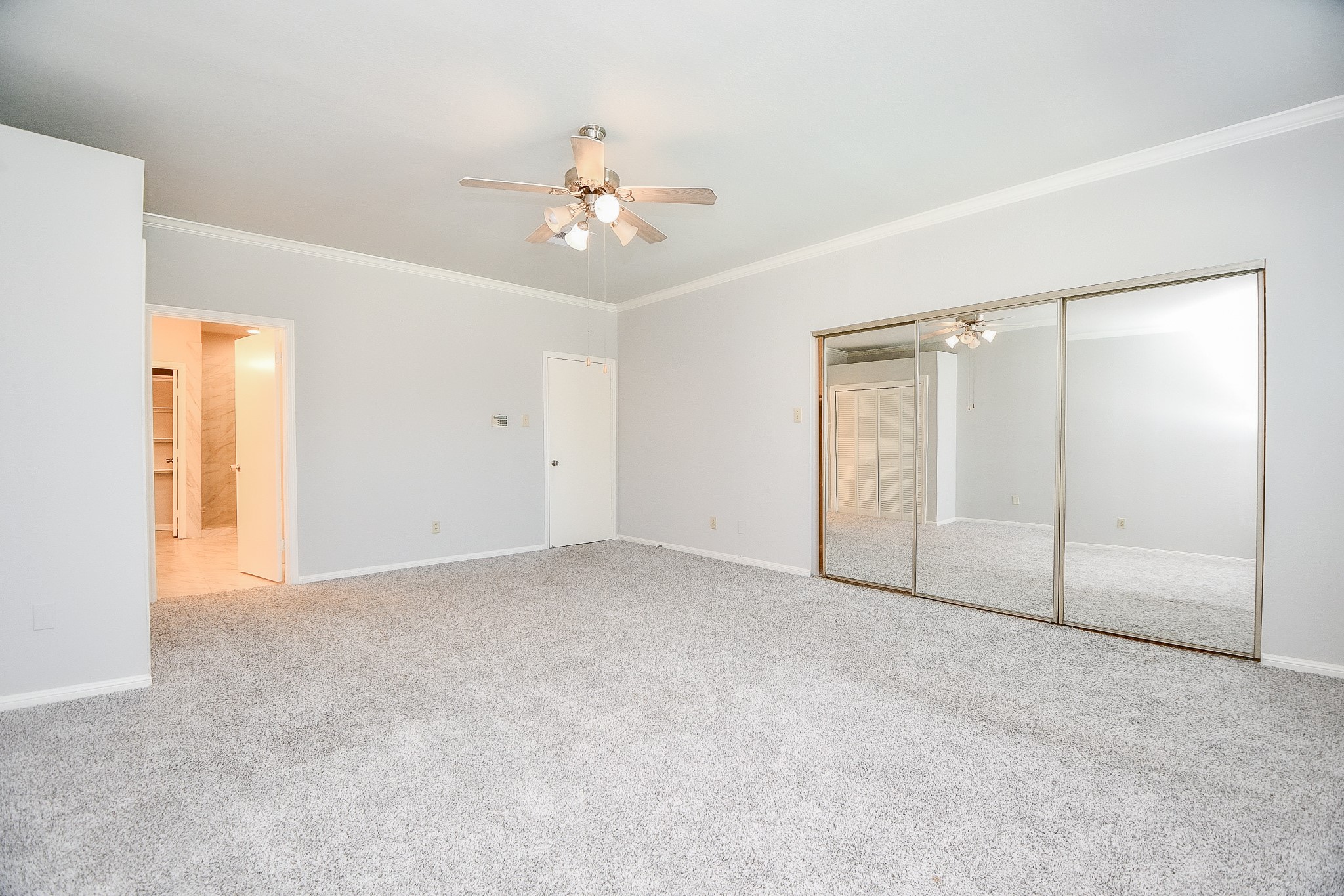 8085 El Mundo Street, Unit 8085 Houston, TX 77054 - Photo 14 of 32 a view of an empty room with a ceiling fan