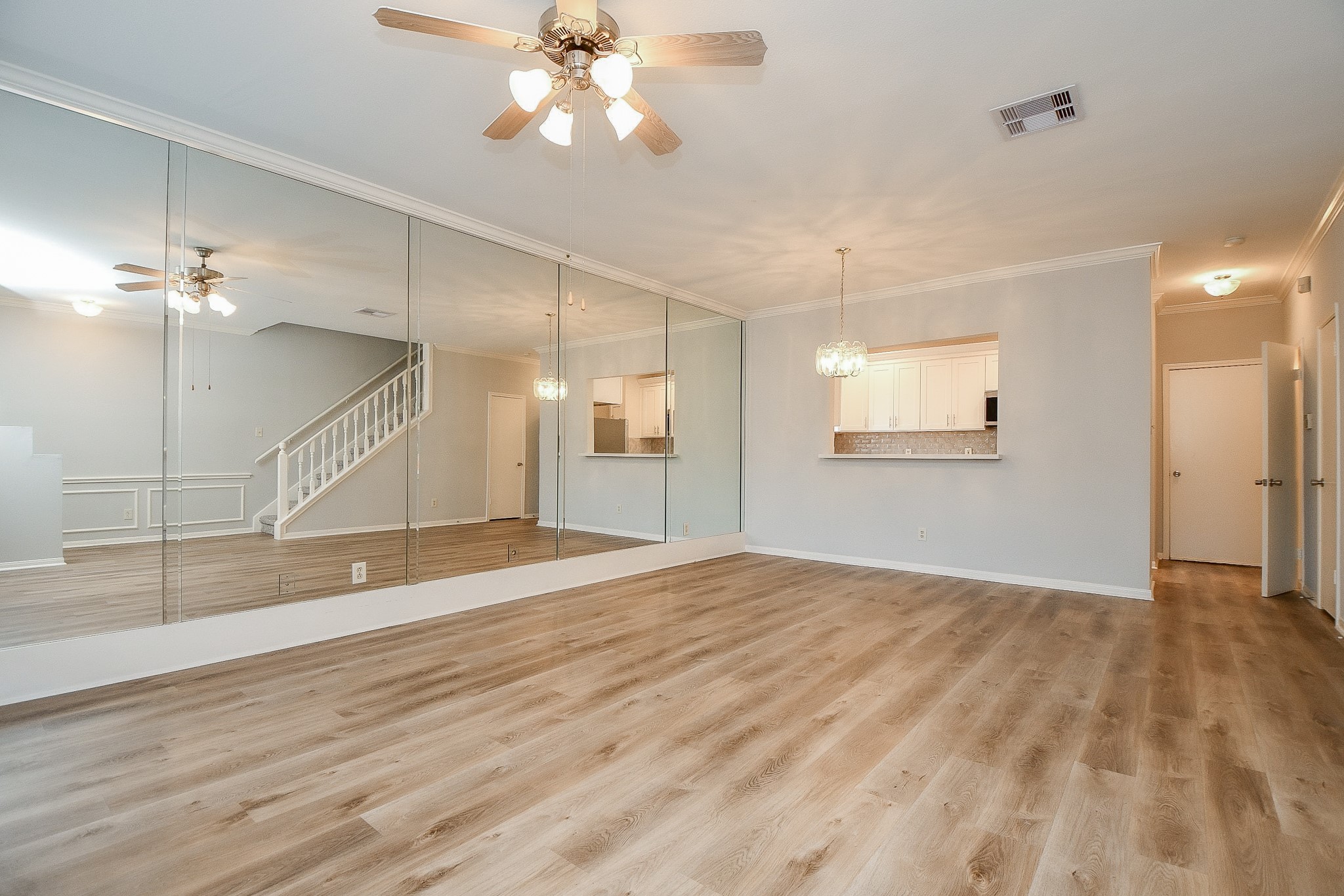 8085 El Mundo Street, Unit 8085 Houston, TX 77054 - Photo 2 of 32 a view of an empty room with a ceiling fan and window