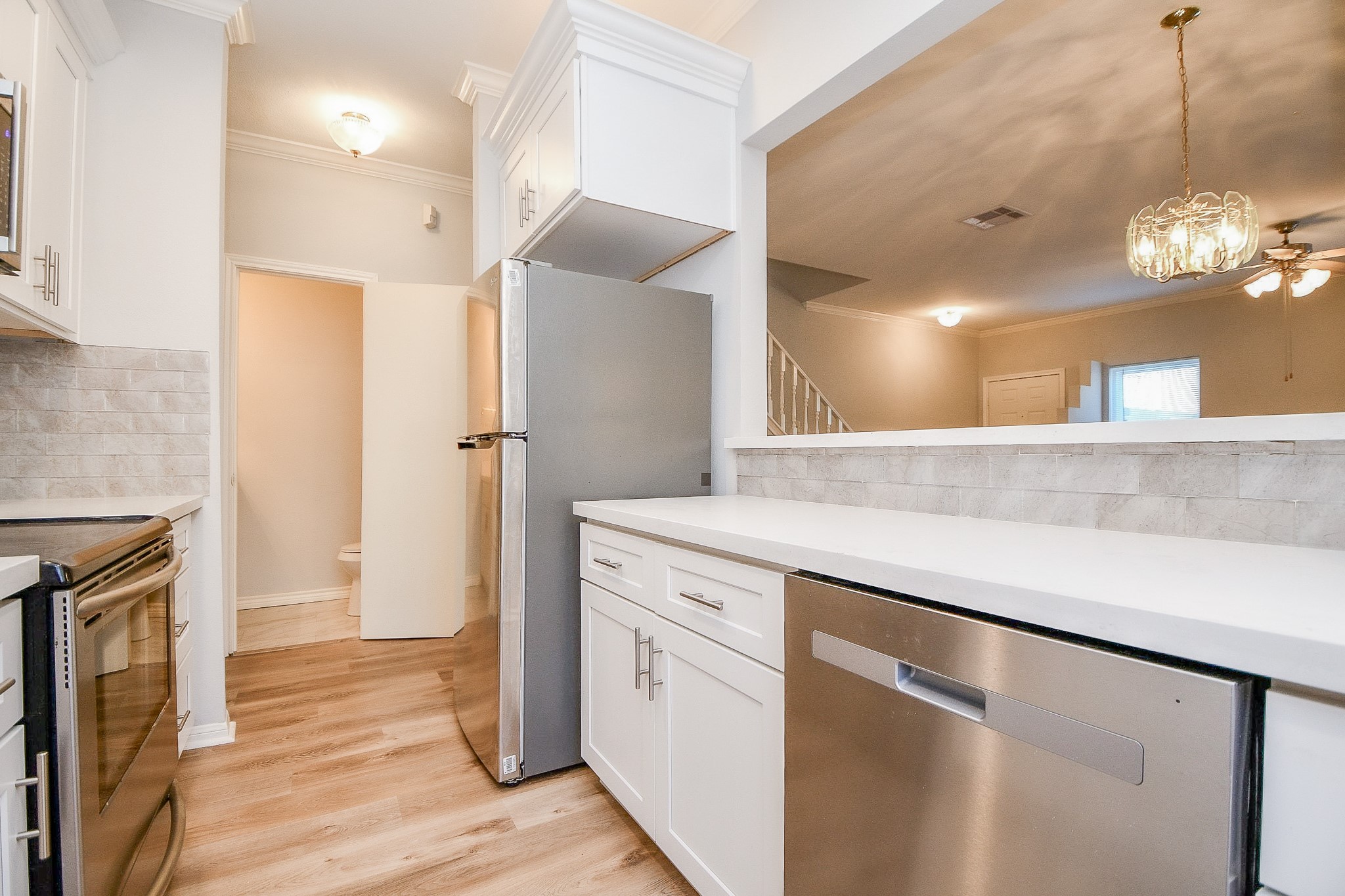 8085 El Mundo Street, Unit 8085 Houston, TX 77054 - Photo 5 of 32 a bathroom with a sink a mirror and a shower