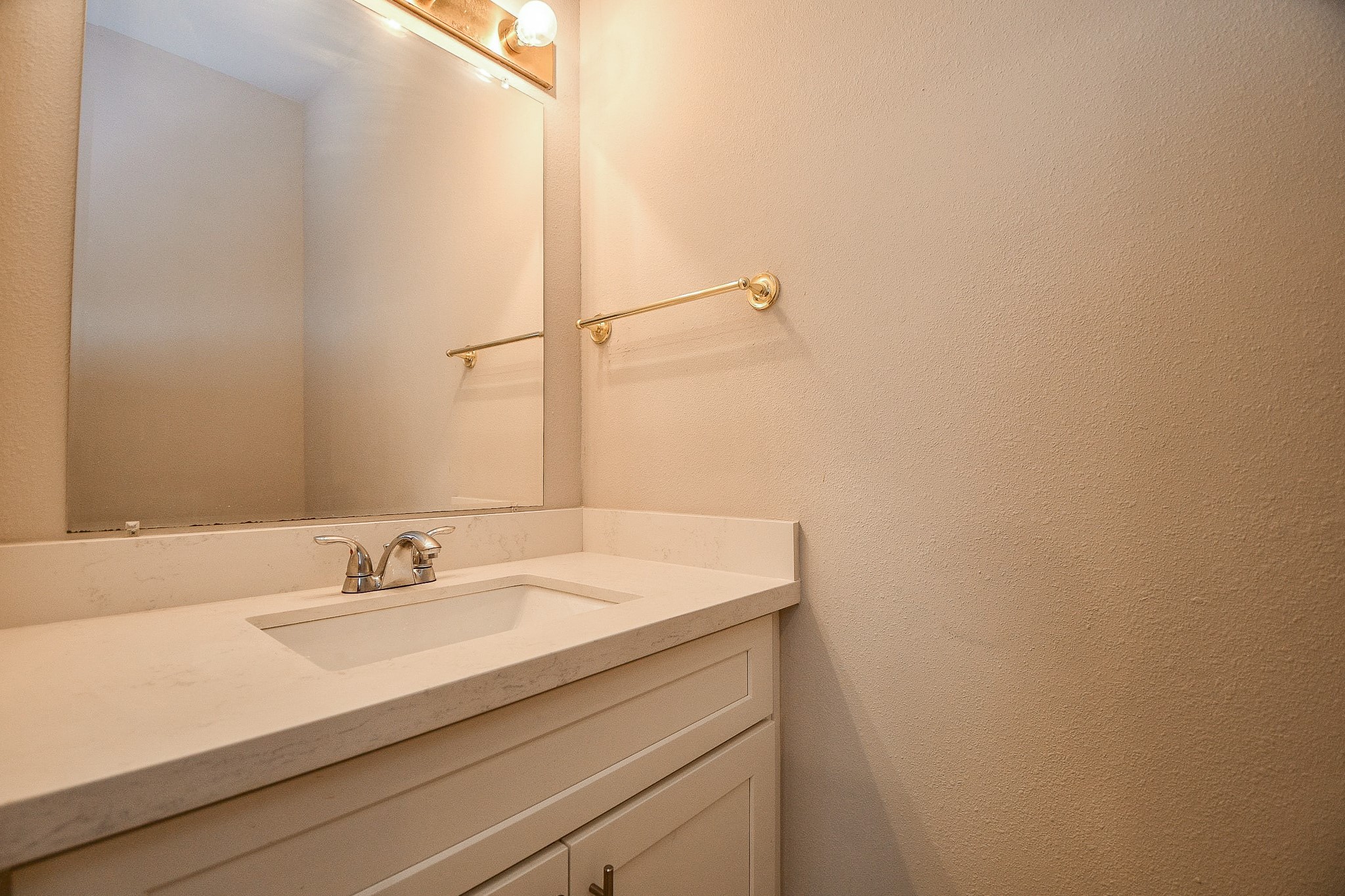 8085 El Mundo Street, Unit 8085 Houston, TX 77054 - Photo 9 of 32 a bathroom with a sink and a mirror