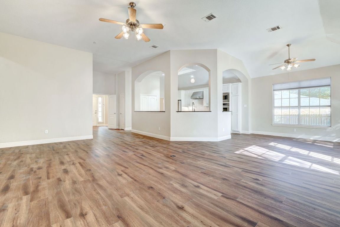 301 Rim Rock Drive Georgetown, TX 78628 - Photo 11 of 40 Living area looking into the kitchen and breakfast dining