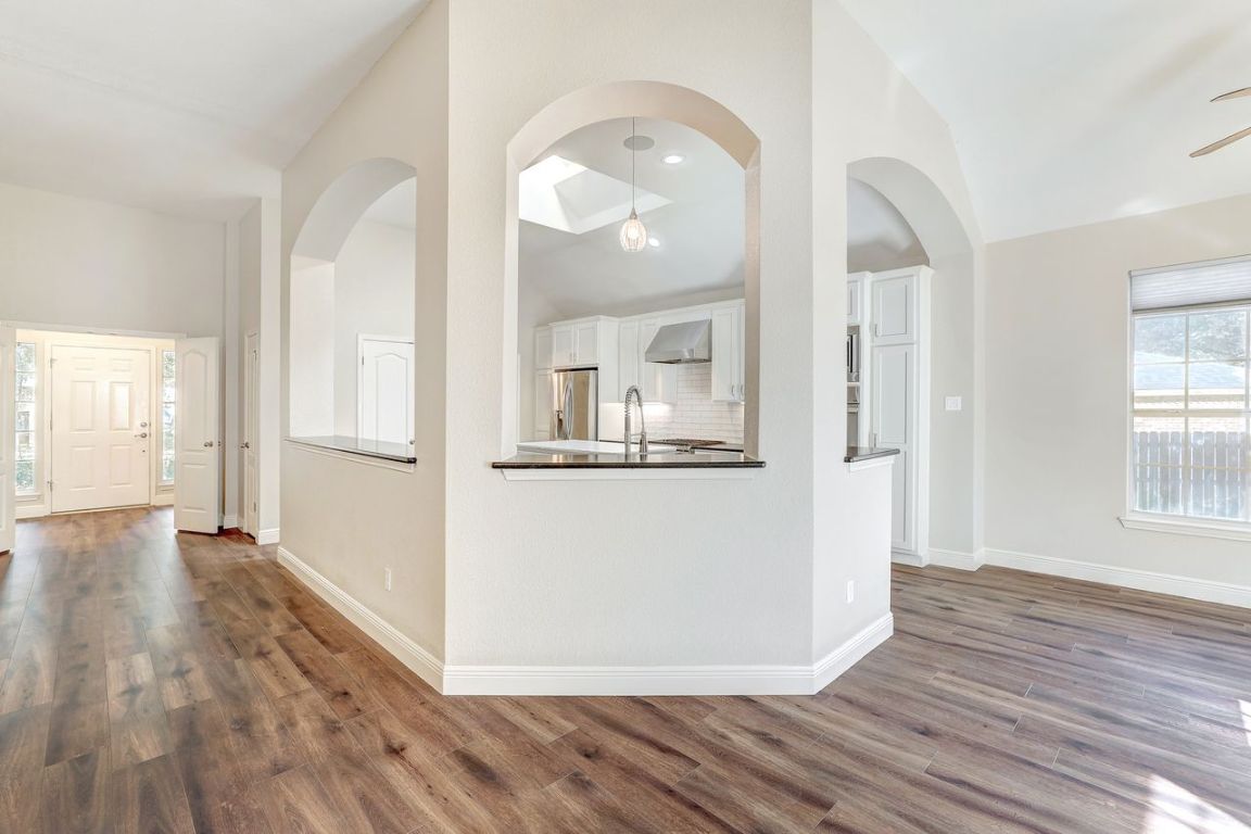301 Rim Rock Drive Georgetown, TX 78628 - Photo 14 of 40 Living and kitchen area
