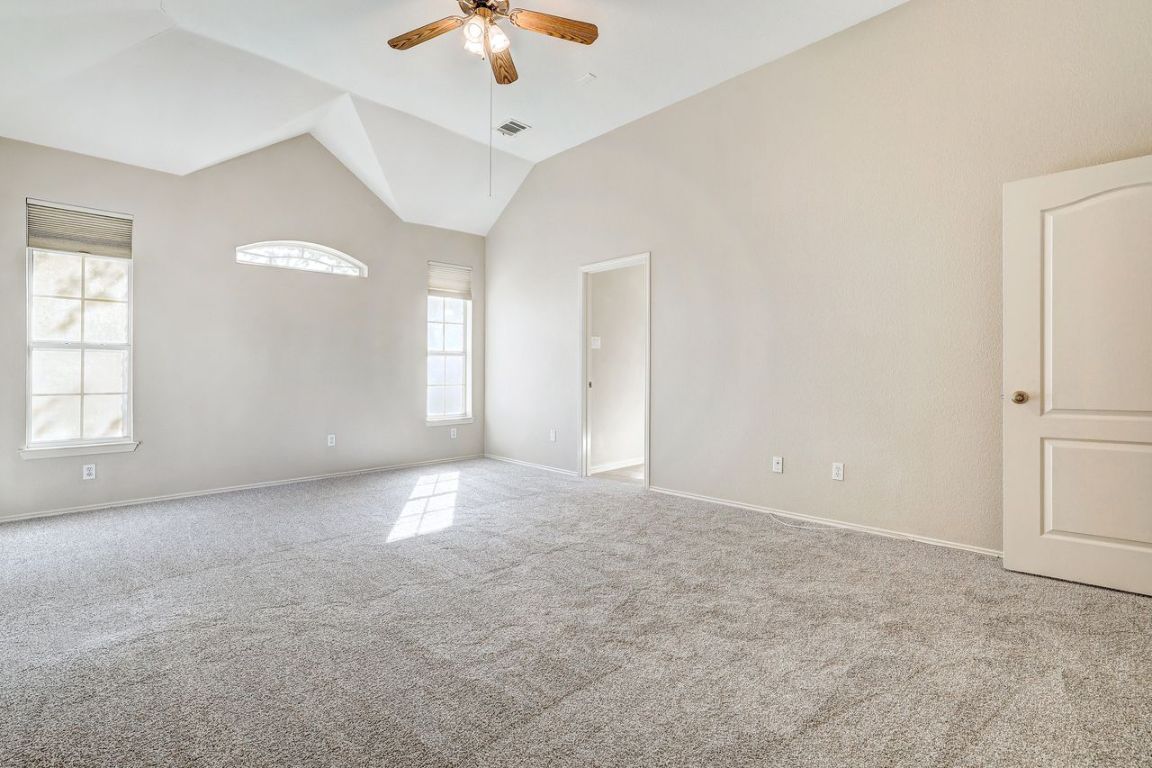 301 Rim Rock Drive Georgetown, TX 78628 - Photo 19 of 40 With ceiling fan and high vaulted ceiling
