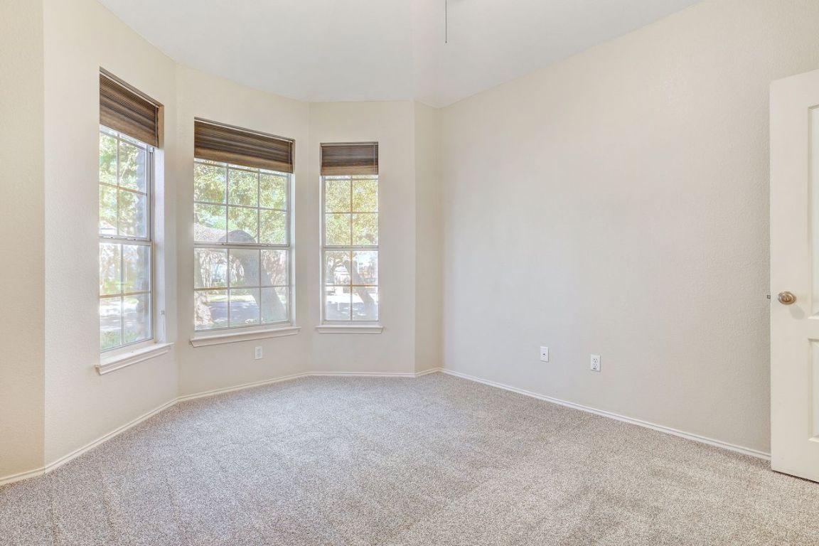 301 Rim Rock Drive Georgetown, TX 78628 - Photo 32 of 40 Carpeted spare room with plenty of natural light