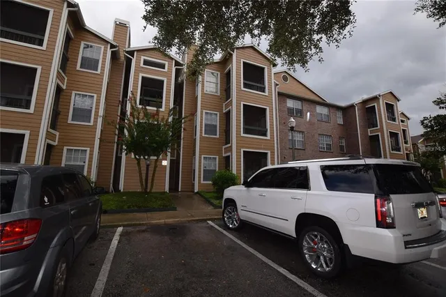 a view of a car park in front of a building