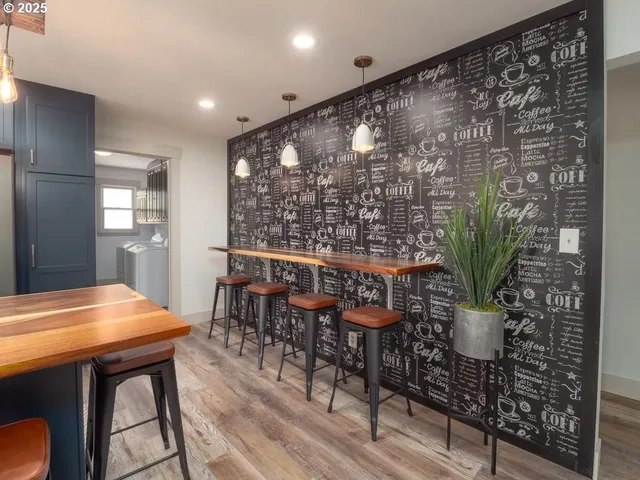a view of a room with a table and chairs in a room