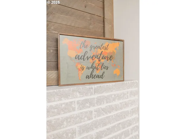 a picture of a bathroom with a white wall