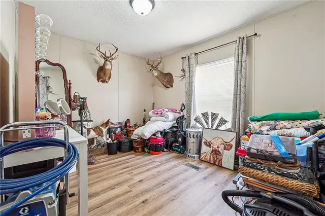 a room with lots of stuff and hardwood floor