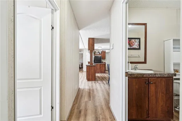 a view of a kitchen from the hallway