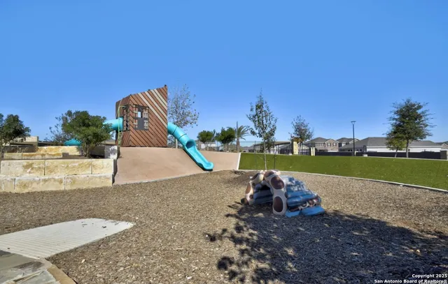 a view of a park with large trees