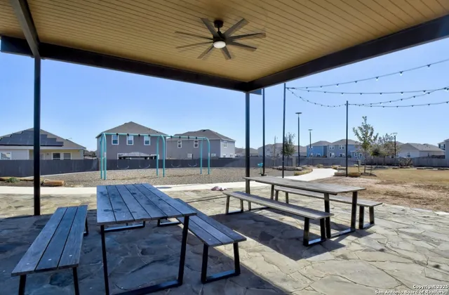 a living room with couch and wooden floor
