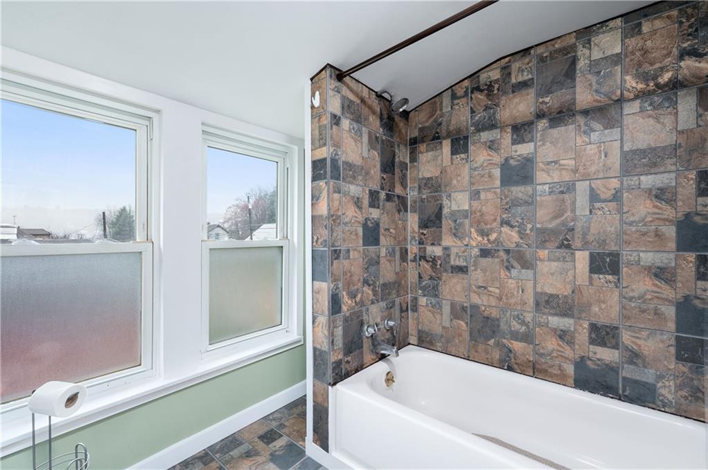 140 Whitestown Road Lyndora, PA 16045 - Photo 19 of 29 a bathroom with a bathtub and a shower
