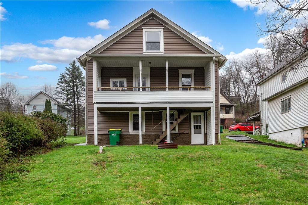140 Whitestown Road Lyndora, PA 16045 - Photo 27 of 29 a front view of a house with a yard and garage