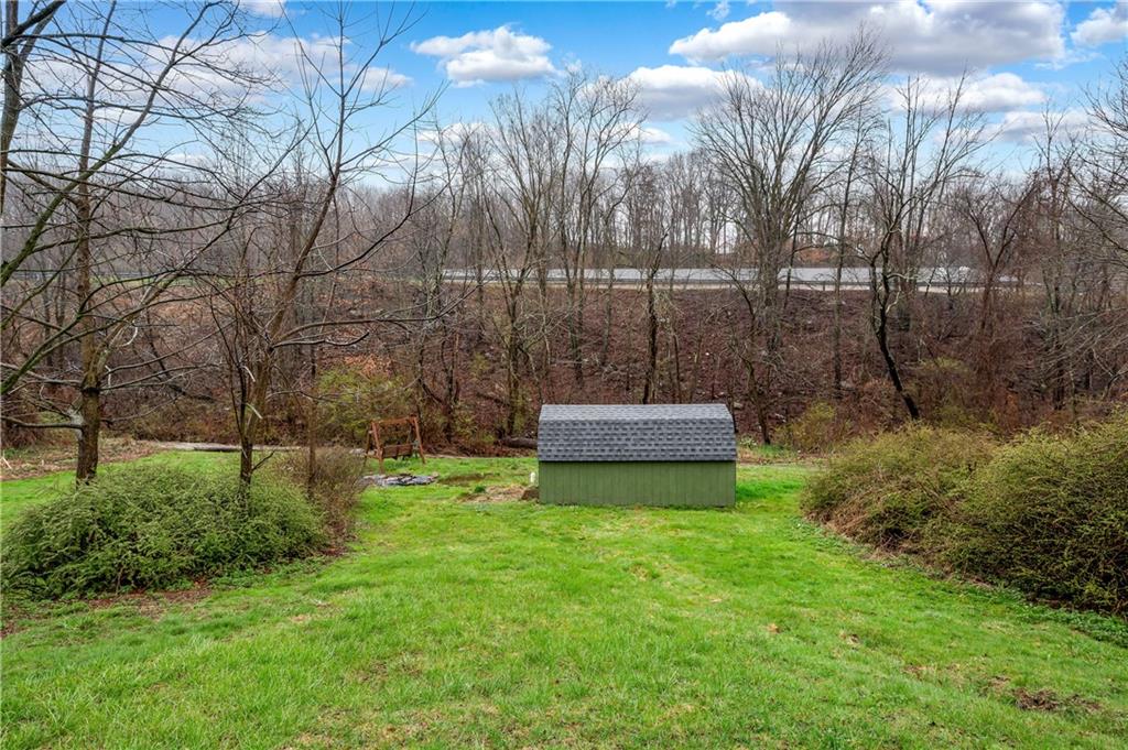 140 Whitestown Road Lyndora, PA 16045 - Photo 28 of 29 a view of a backyard with large trees