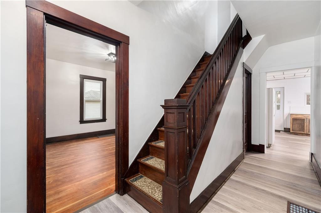 140 Whitestown Road Lyndora, PA 16045 - Photo 5 of 29 a view of a hallway with wooden floor and staircase
