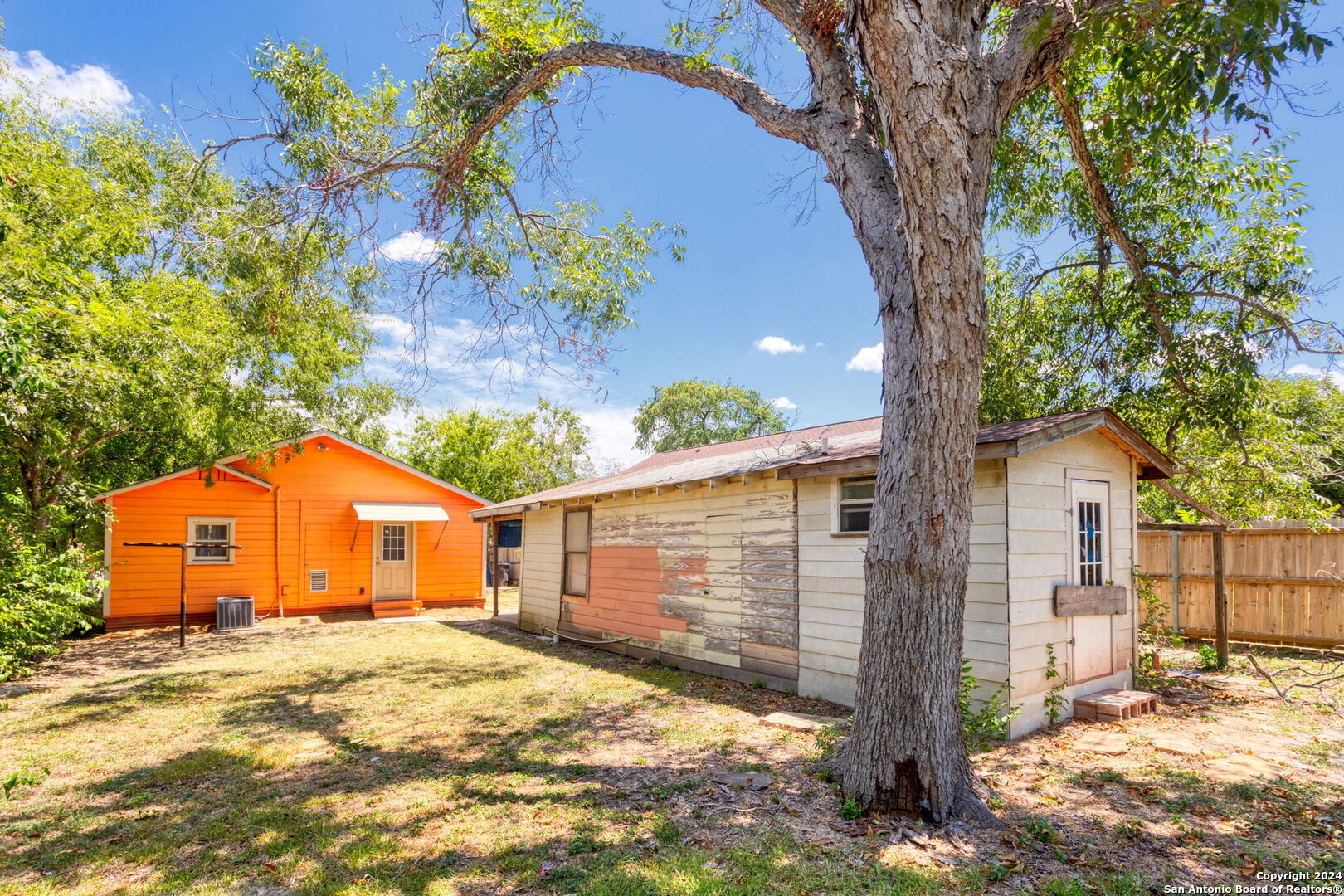 113 Vista Road San Antonio, TX 78210 - Photo 15 of 17 a backyard of a house with large trees and wooden fence