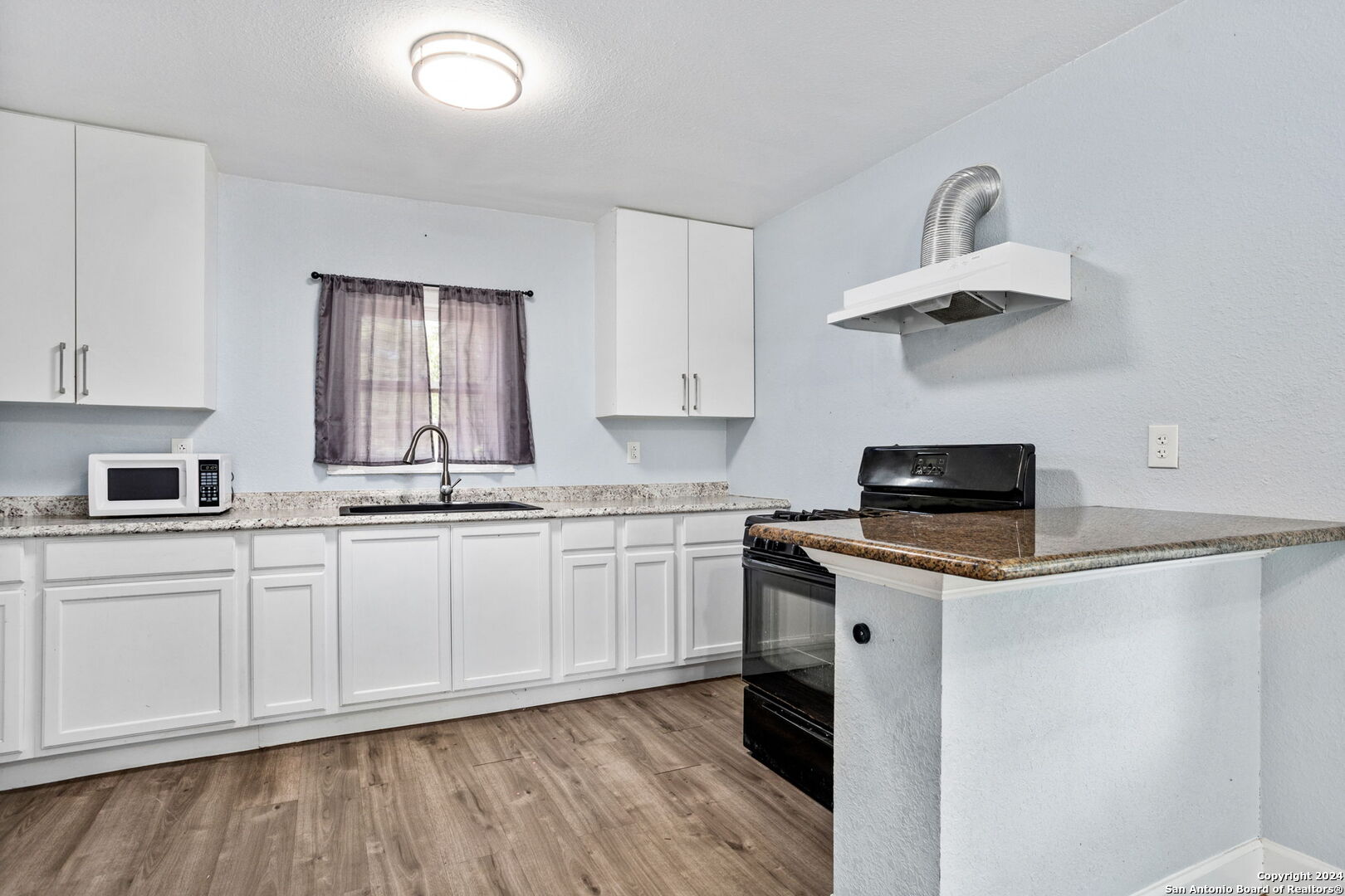 113 Vista Road San Antonio, TX 78210 - Photo 8 of 17 a kitchen with appliances cabinets and a sink