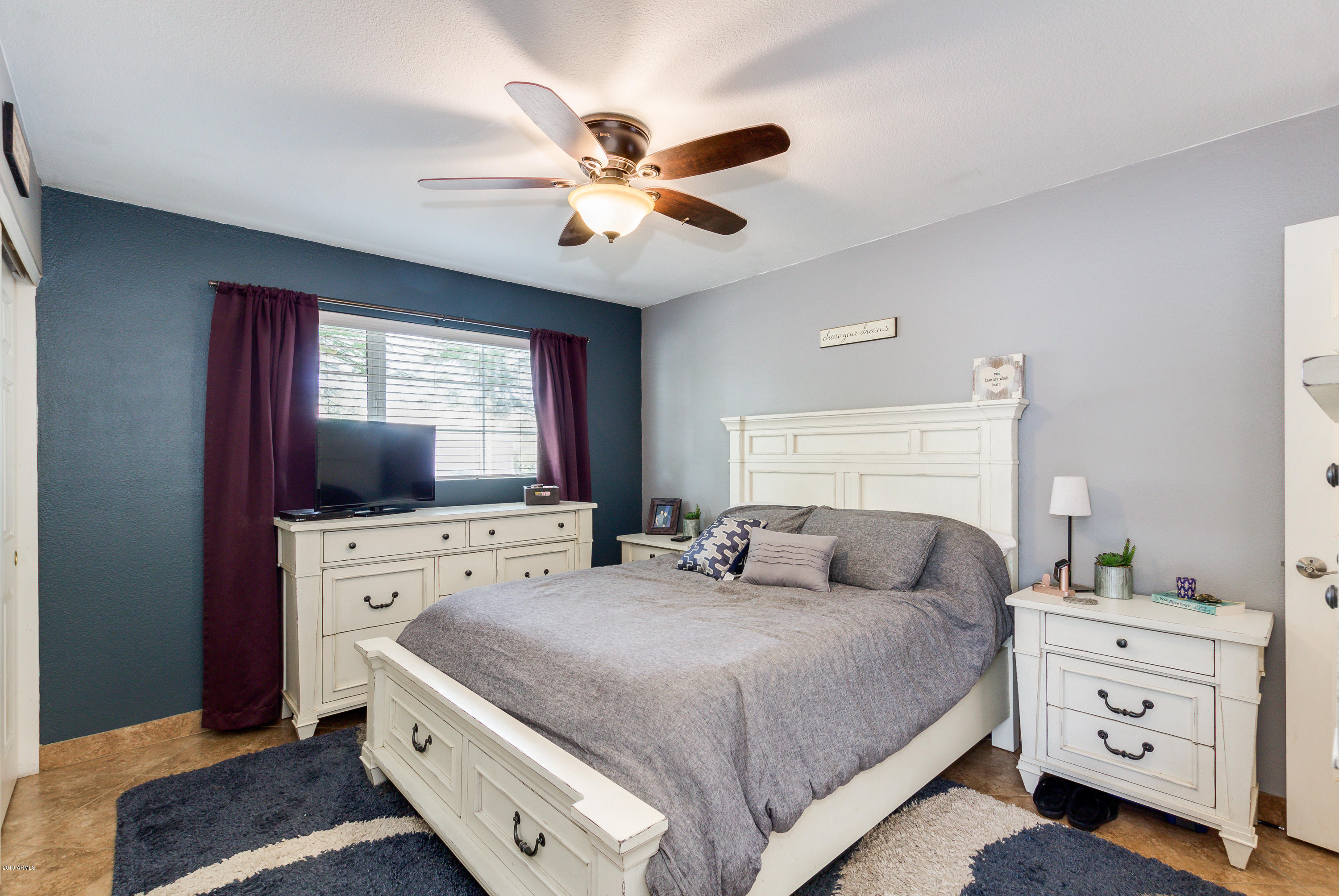 3021 West Bloomfield Road Phoenix, AZ 85029 - Photo 17 of 27 a bedroom with a bed and a dresser