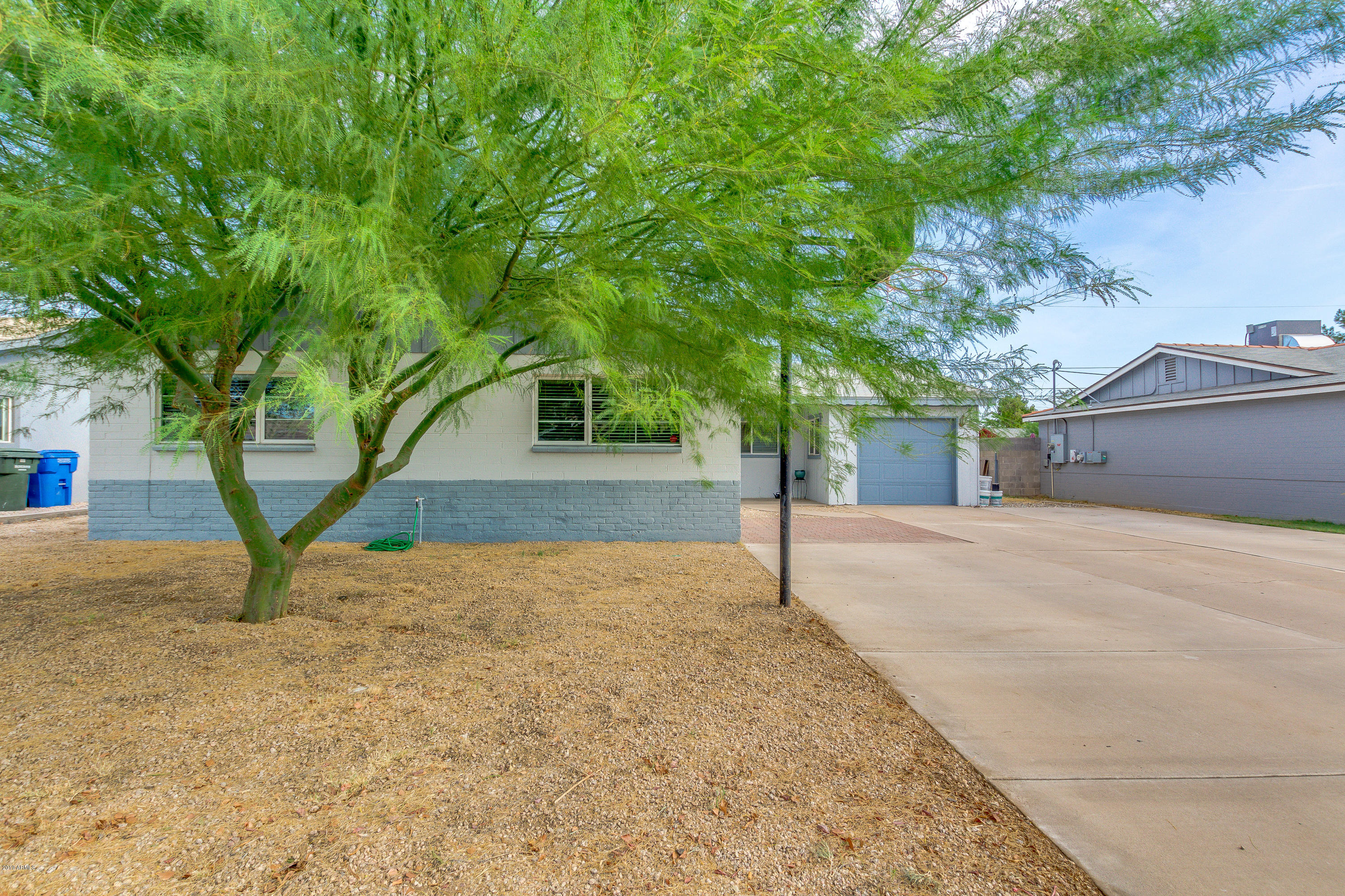 3021 West Bloomfield Road Phoenix, AZ 85029 - Photo 2 of 27 a house with trees in front of it