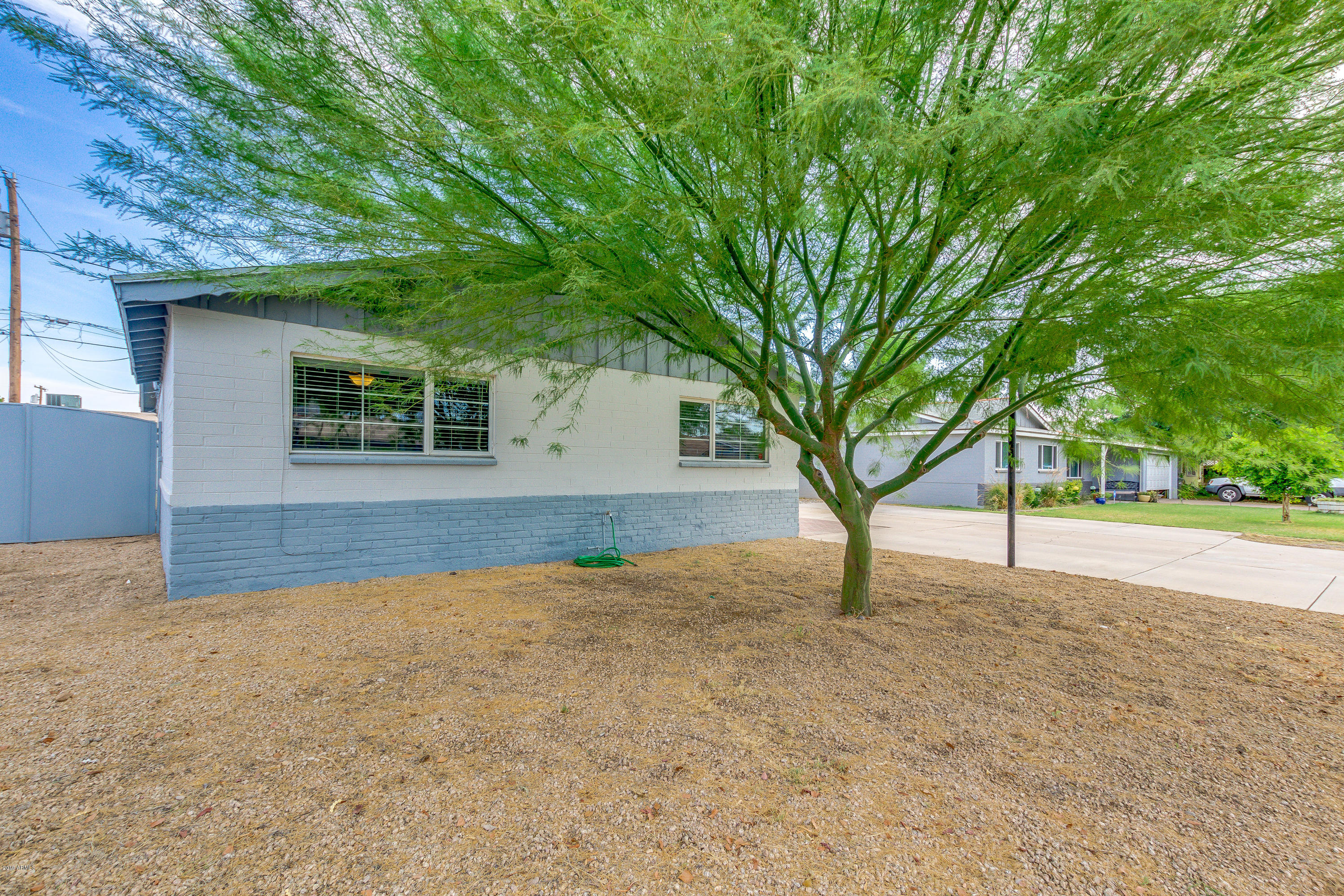 3021 West Bloomfield Road Phoenix, AZ 85029 - Photo 3 of 27 a view of a house with a tree