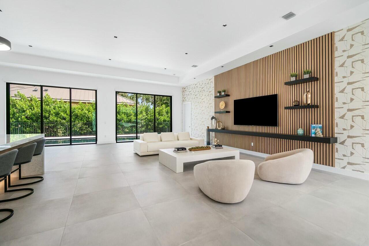 751 Pelican Way North Palm Beach, FL 33408 - Photo 13 of 39 a living room with furniture and a flat screen tv