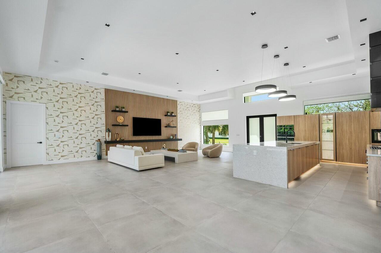 751 Pelican Way North Palm Beach, FL 33408 - Photo 14 of 39 a living room with furniture and a flat screen tv