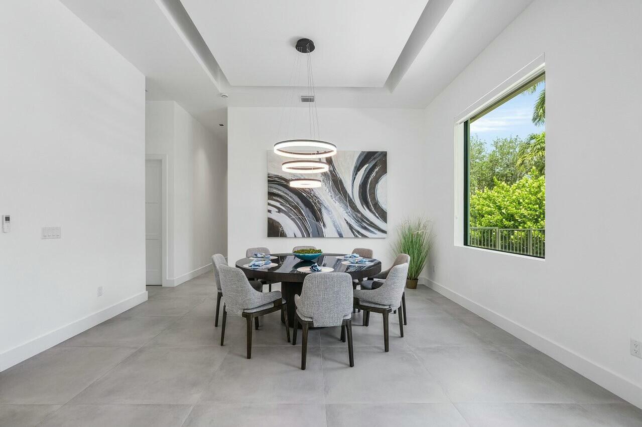 751 Pelican Way North Palm Beach, FL 33408 - Photo 19 of 39 a view of a dining room with furniture window and outside view