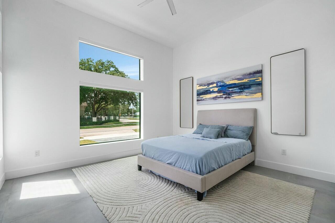 751 Pelican Way North Palm Beach, FL 33408 - Photo 24 of 39 a bedroom with a bed and window