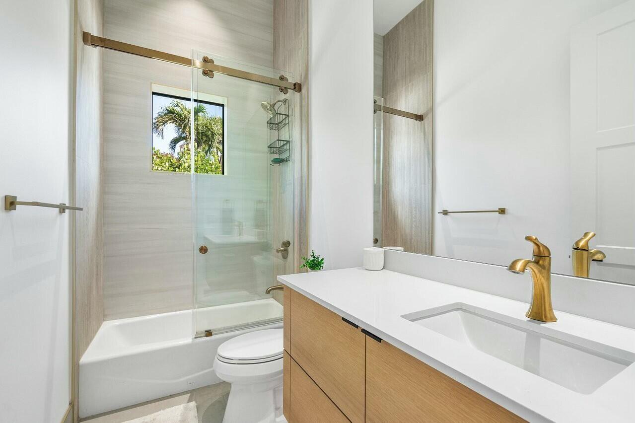 751 Pelican Way North Palm Beach, FL 33408 - Photo 28 of 39 a bathroom with a sink a toilet and shower