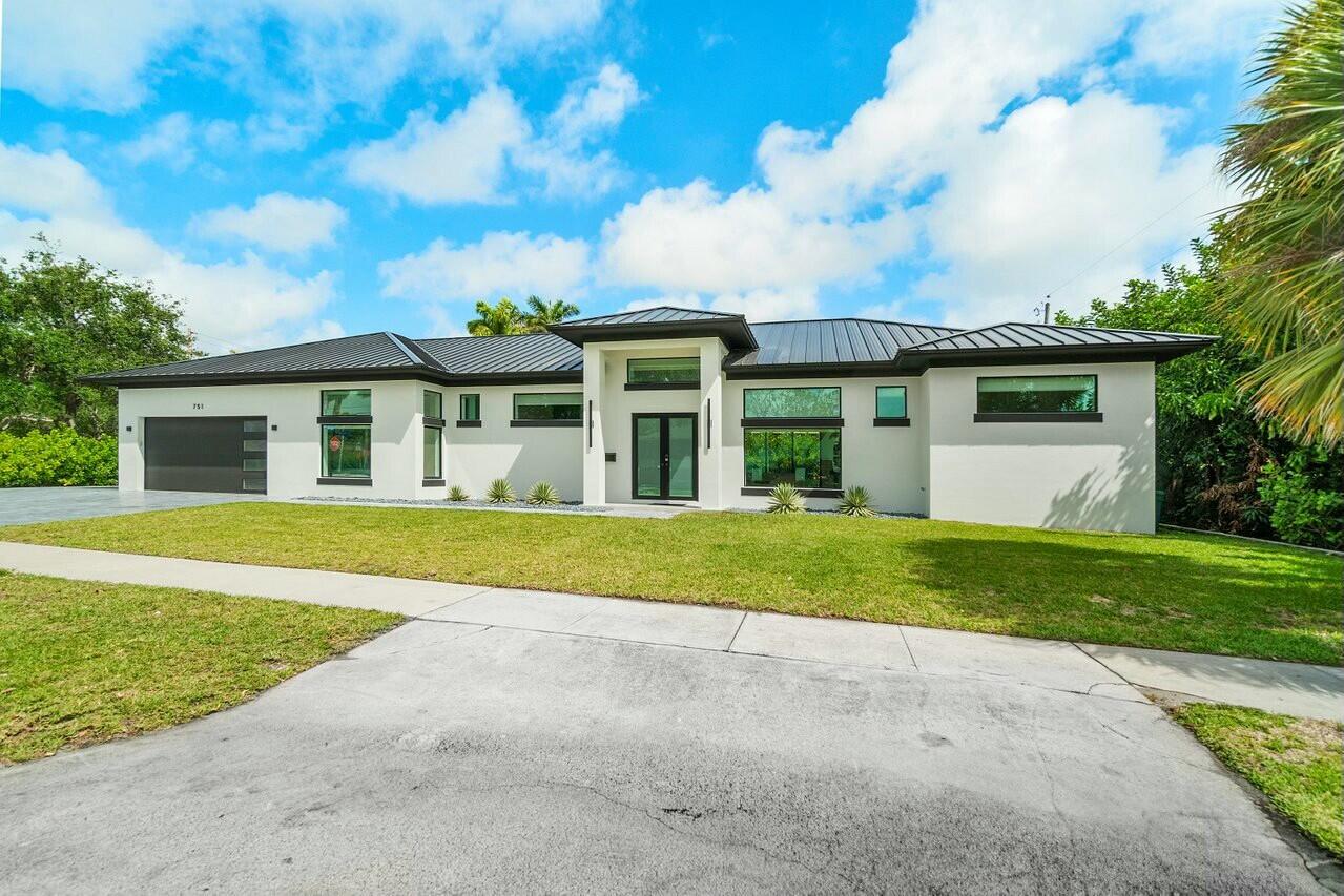 751 Pelican Way North Palm Beach, FL 33408 - Photo 3 of 39 a view of front a house with a yard