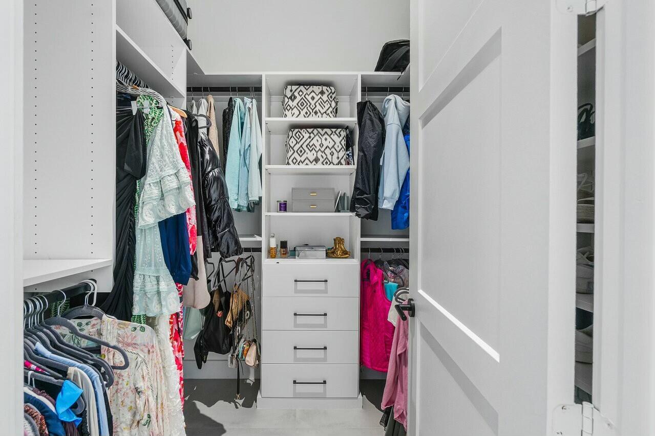 751 Pelican Way North Palm Beach, FL 33408 - Photo 31 of 39 a view of walk in closet with clothes