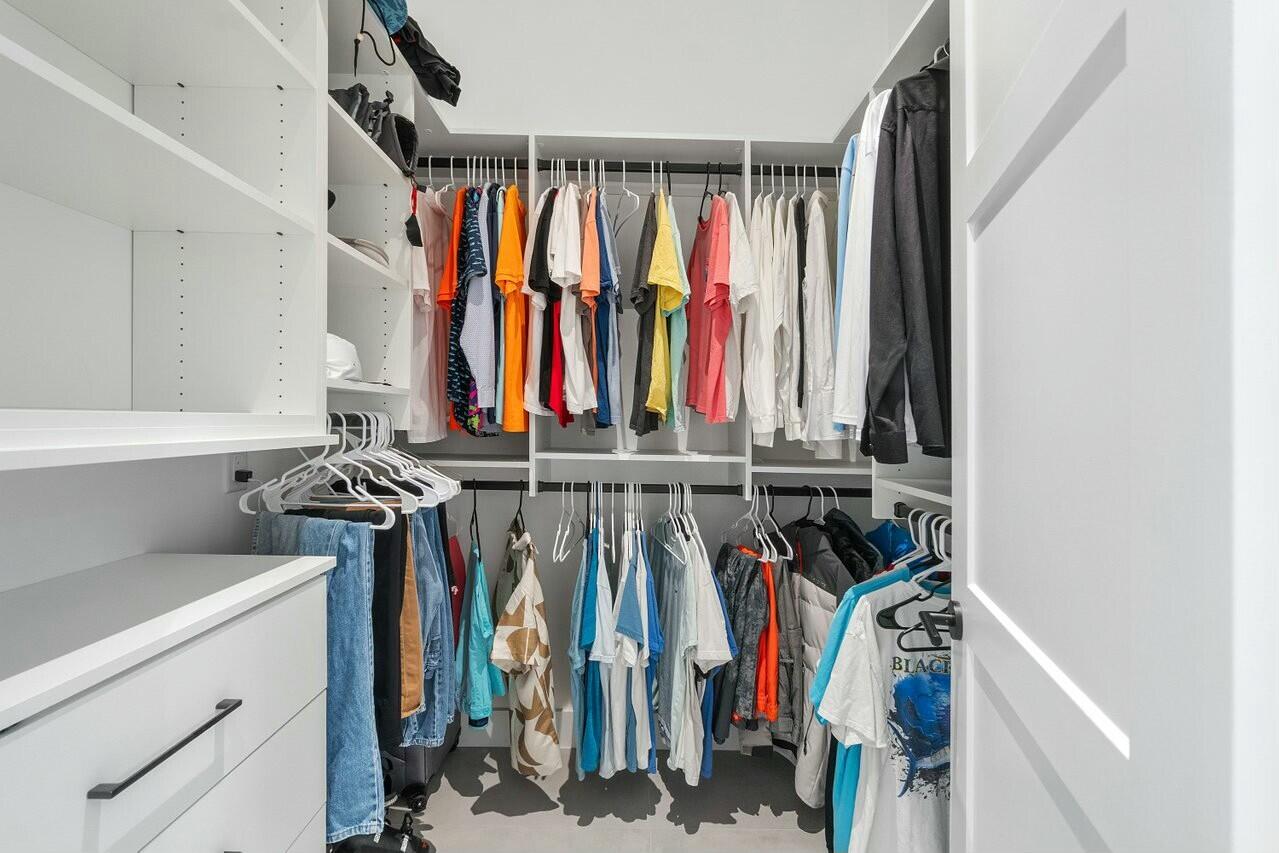 751 Pelican Way North Palm Beach, FL 33408 - Photo 32 of 39 a view of walk in closet with clothes