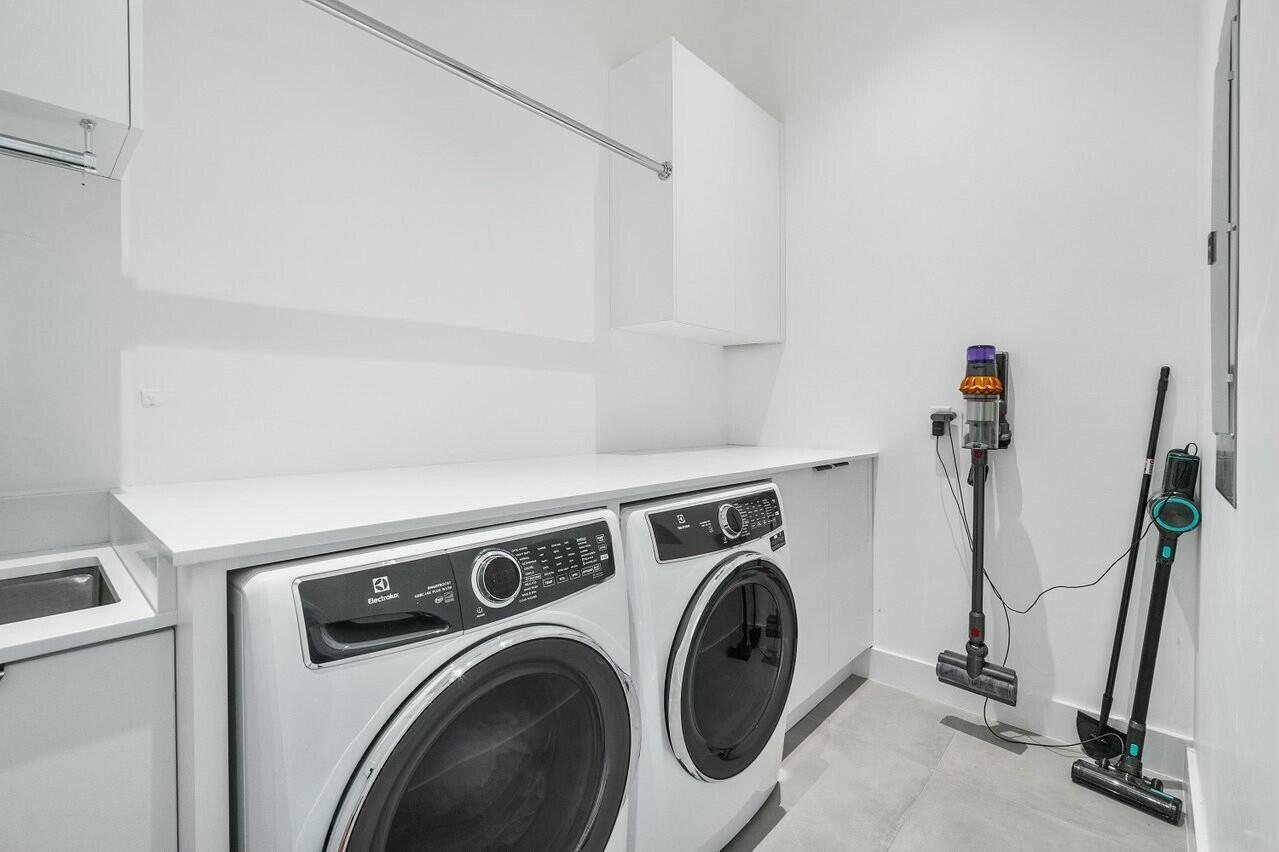 751 Pelican Way North Palm Beach, FL 33408 - Photo 33 of 39 a utility room with dryer and washer