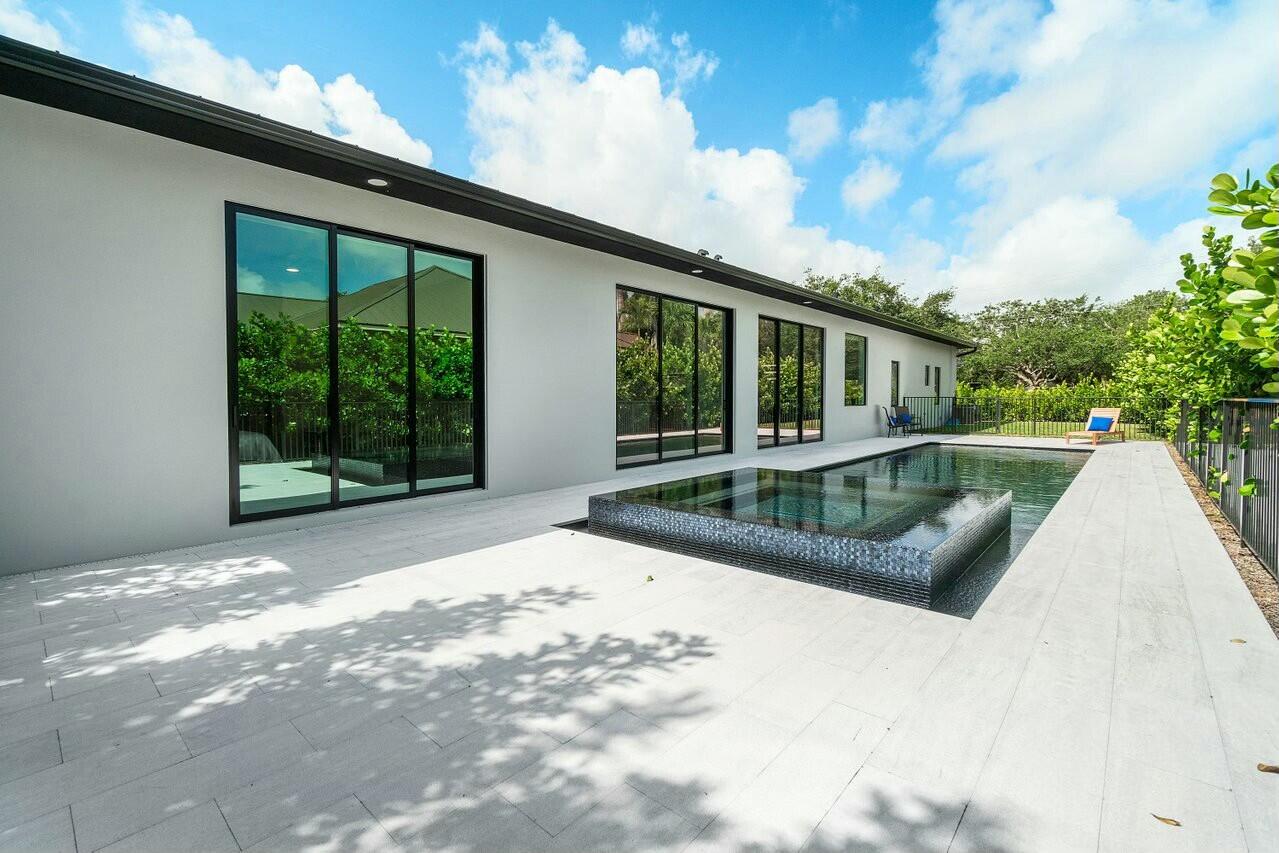 751 Pelican Way North Palm Beach, FL 33408 - Photo 6 of 39 a view of a house with backyard and sitting area