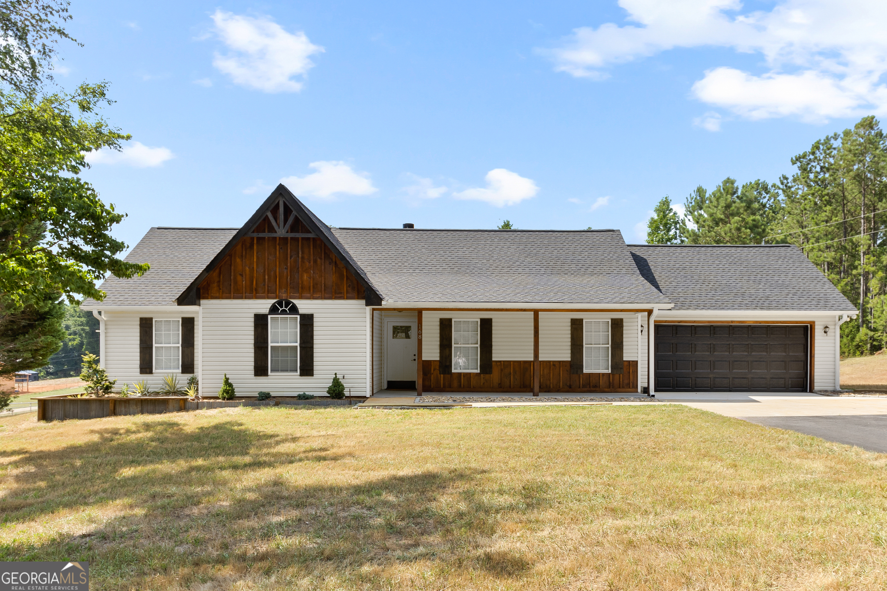 168 Rocky Point Road Covington, GA 30014 - Photo 1 of 1 a front view of a house with a yard