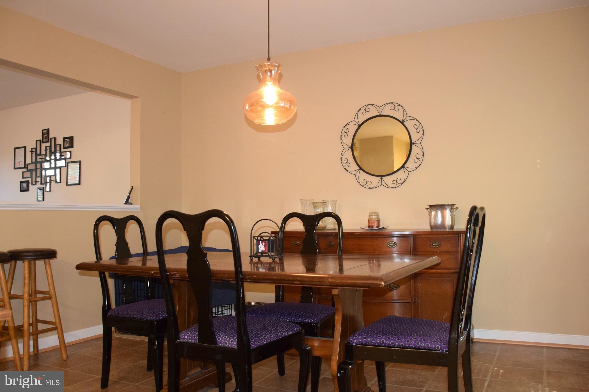 250 Spring Hollow Road Front Royal, VA 22630 - Photo 14 of 30 a kitchen with a table chairs and a dining table