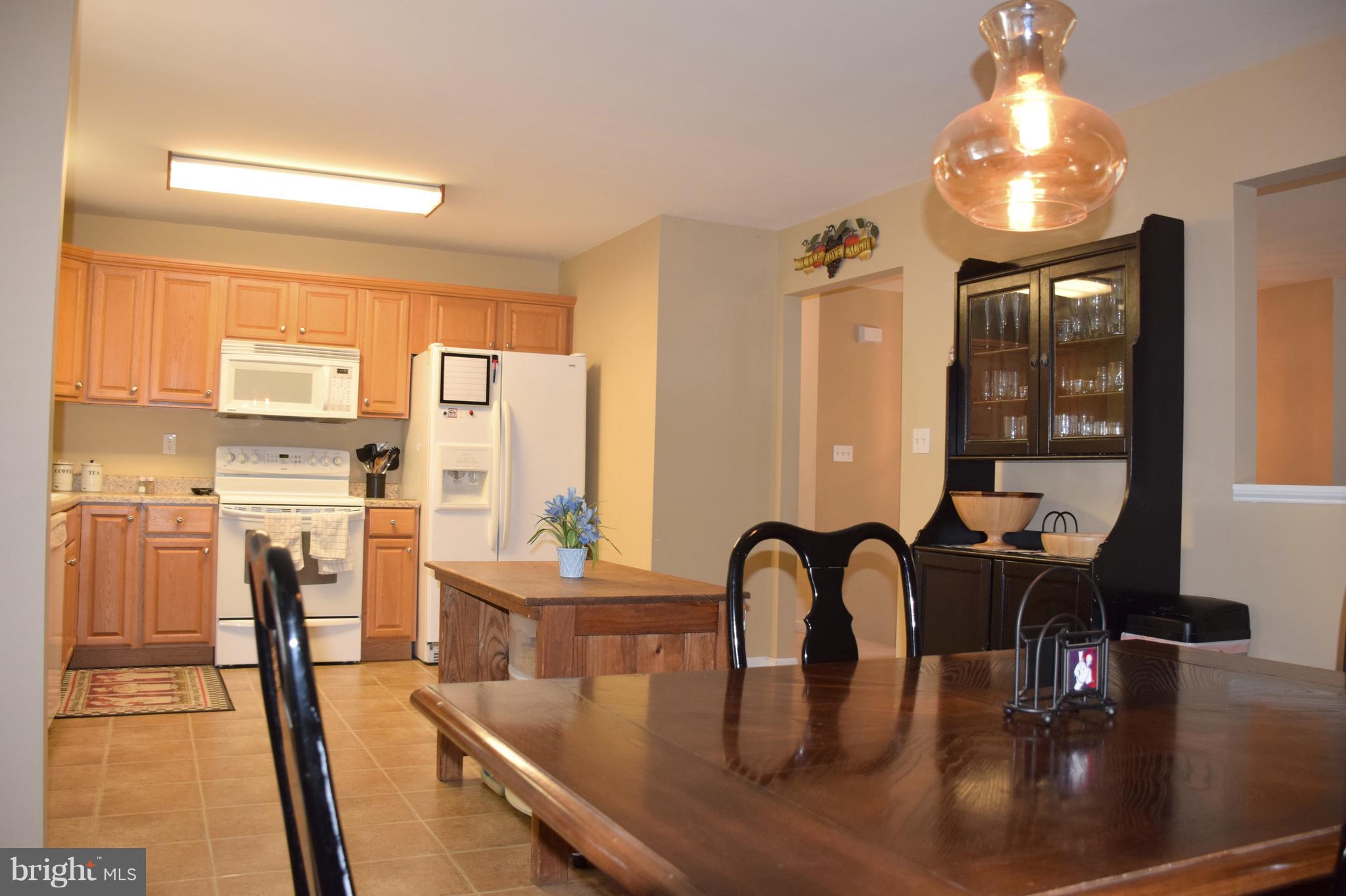 250 Spring Hollow Road Front Royal, VA 22630 - Photo 3 of 30 a dining room with furniture and wooden floor