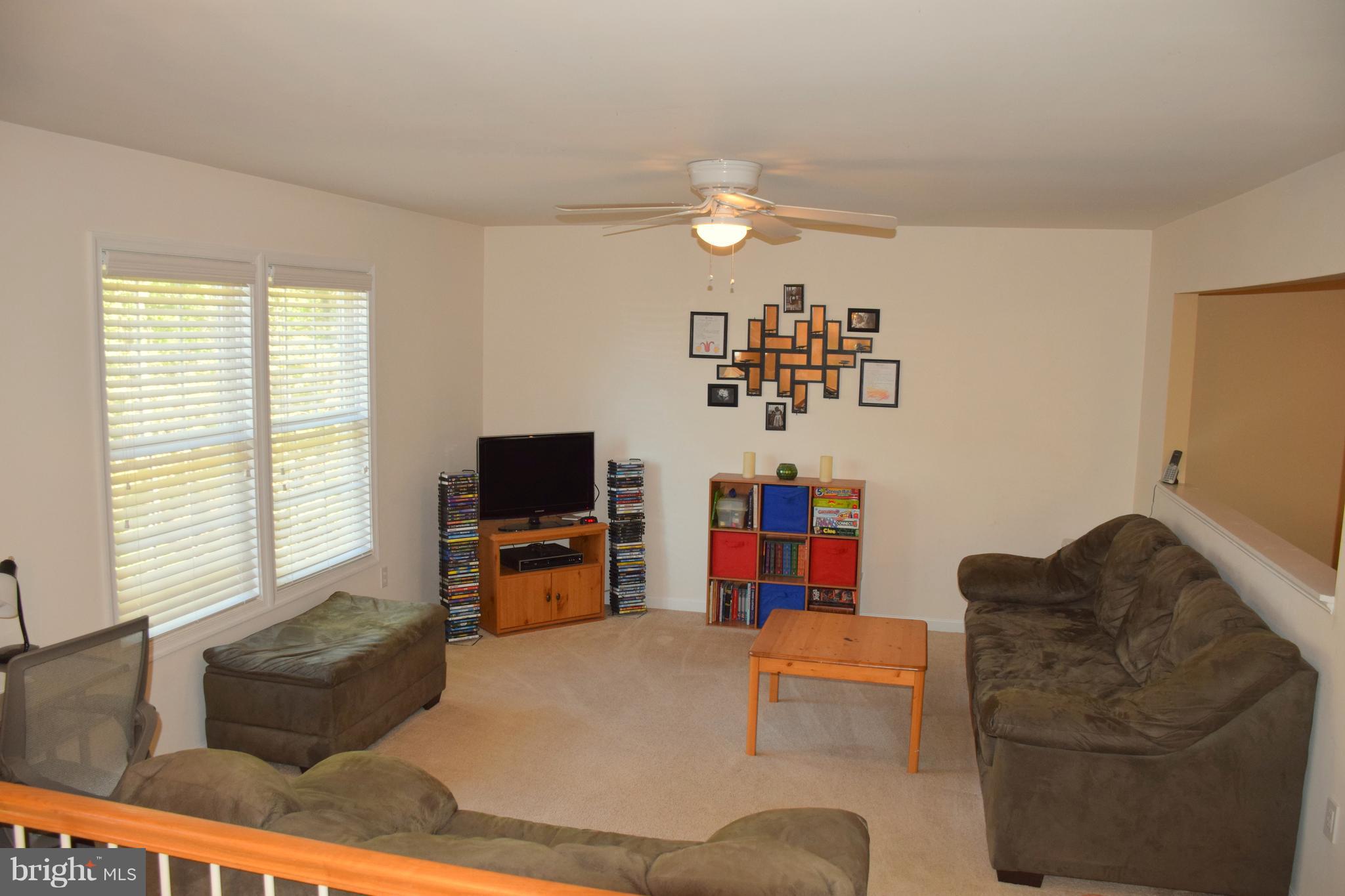 250 Spring Hollow Road Front Royal, VA 22630 - Photo 7 of 30 a living room with furniture and a flat screen tv