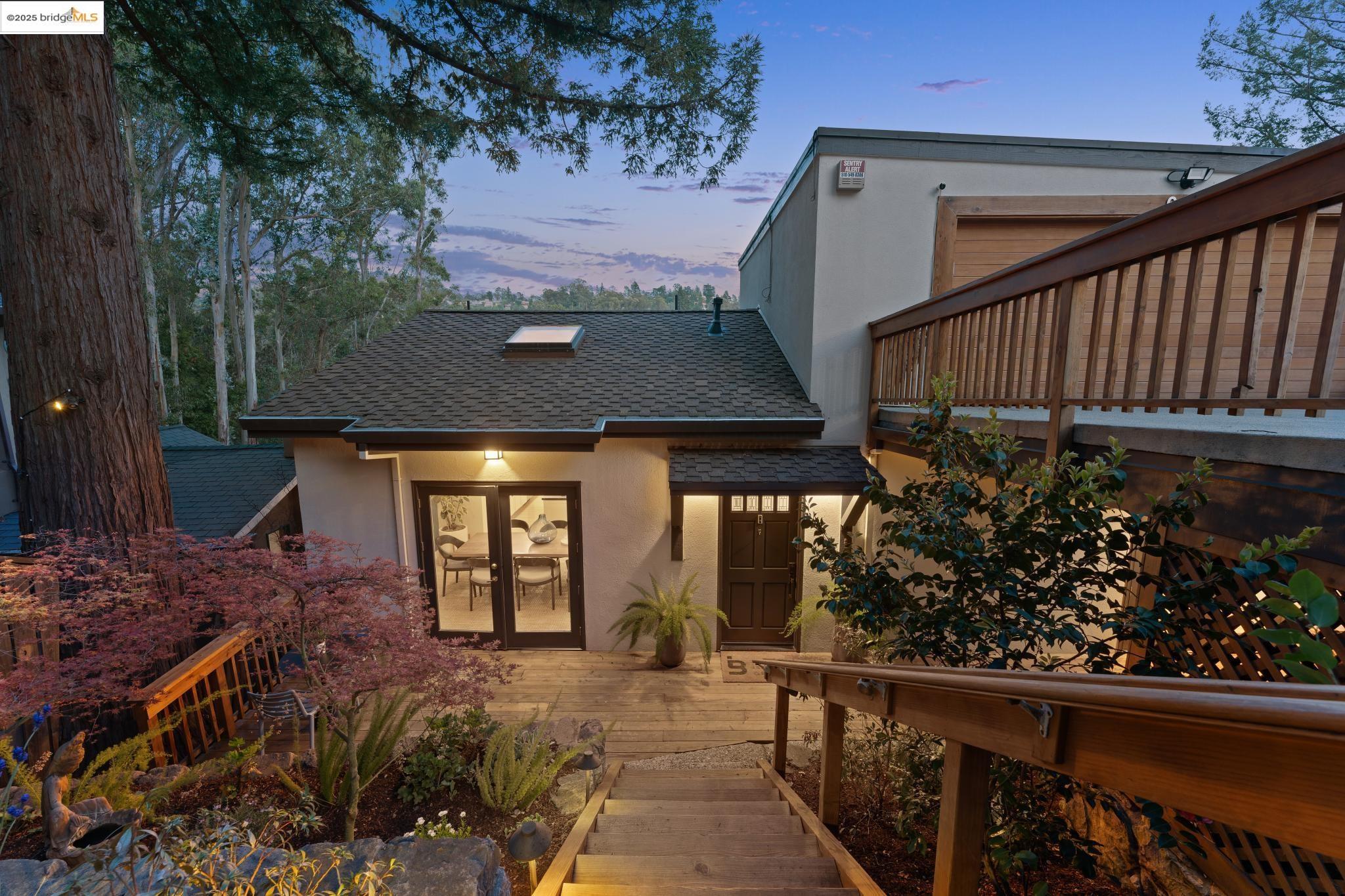 6166 Valley View Road Oakland, CA 94611 - Photo 1 of 1 a view of a house with a flower garden