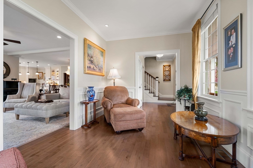 4 Point Shore Overlook Amesbury, MA 01913 - Photo 14 of 42 a living room with furniture and a large mirror with wooden floor